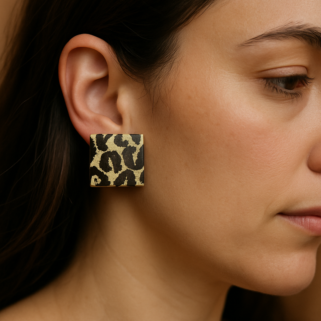 Close-up of a woman wearing a leopard print earring.