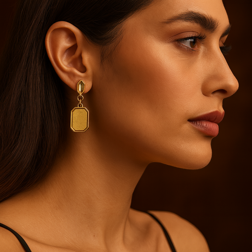 Pair of gold earrings with a geometric design