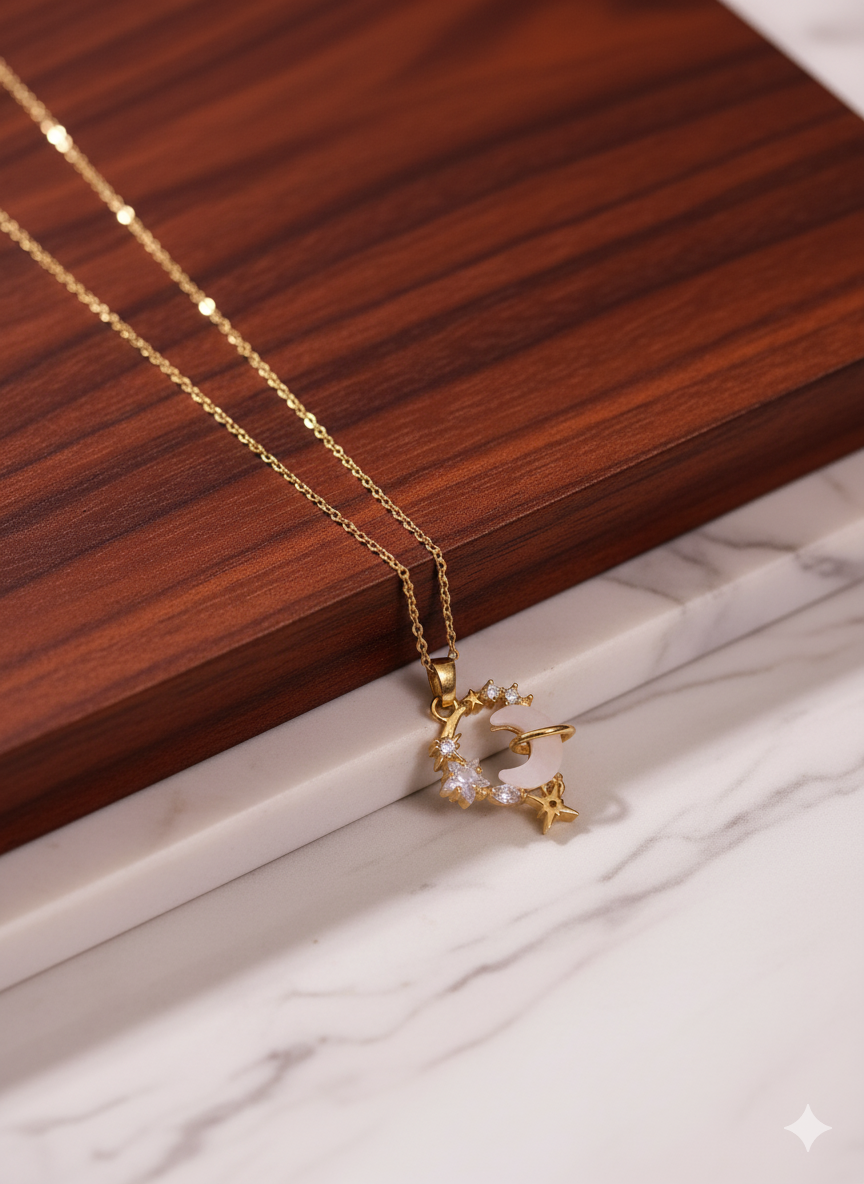 Gold necklace with a star-shaped pendant on a wooden surface
