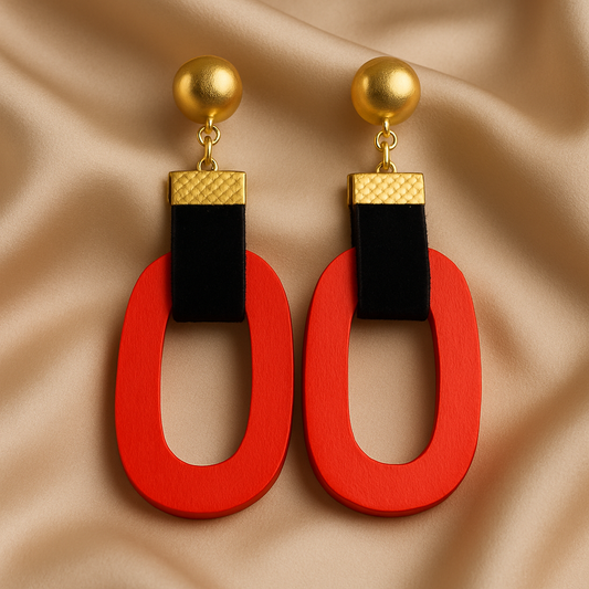 Scarlet Loop Luxe earrings with bold red wooden loops, black velvet straps, and gold-tone studs.