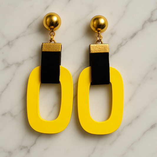 Scarlet Loop Luxe earrings with bold Yellow wooden loops, black velvet straps, and gold-tone studs.