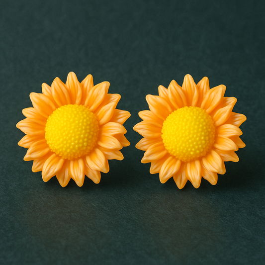 Pair of vibrant yellow sunflower stud earrings with textured centers, displayed on a dark green background.