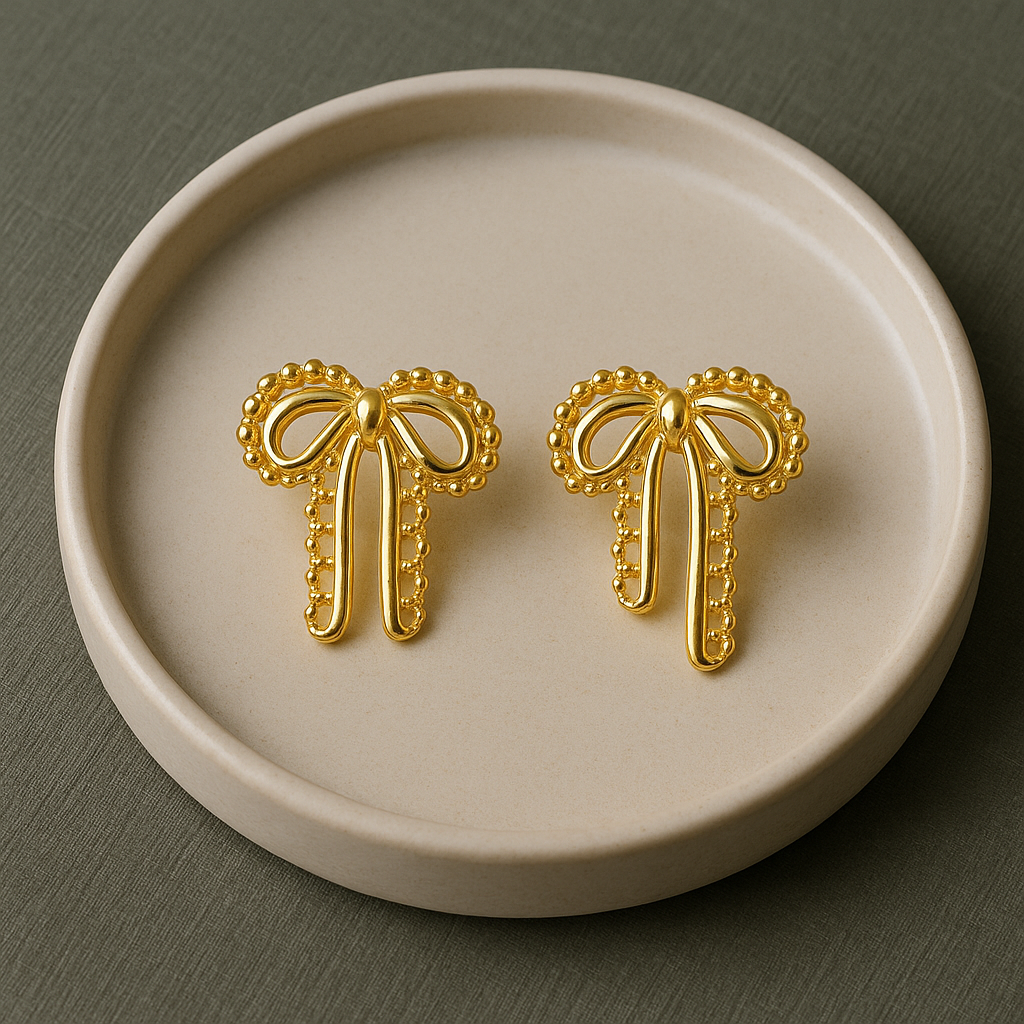 Velour Knot Earrings – elegant gold bow-shaped imitation earrings by Ora Haven, premium lightweight jewelry for everyday and festive styling.