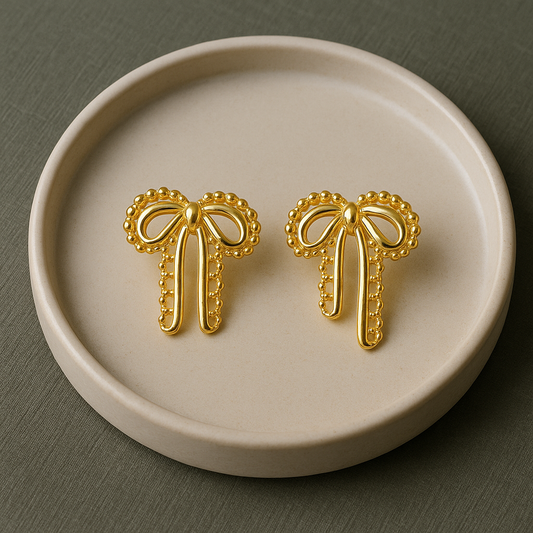 Velour Knot Earrings – elegant gold bow-shaped imitation earrings by Ora Haven, premium lightweight jewelry for everyday and festive styling.