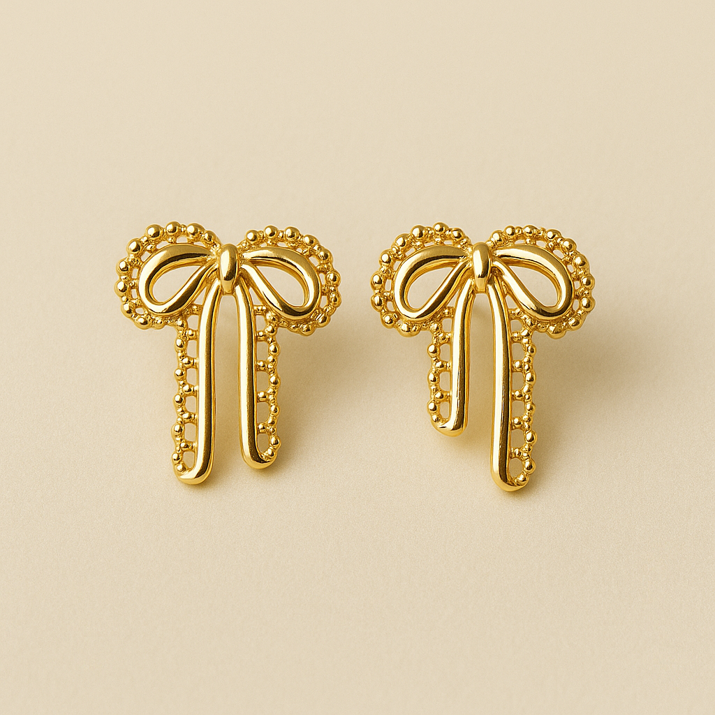 Velour Knot Earrings – elegant gold bow-shaped imitation earrings by Ora Haven, premium lightweight jewelry for everyday and festive styling.