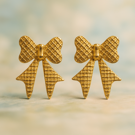 Bold gold bow-shaped statement earrings with waffle-textured finish, vintage-style geometric earrings for women