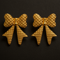 Bold gold bow-shaped statement earrings with waffle-textured finish, vintage-style geometric earrings for women
