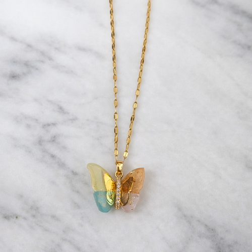 The pendant on a white marble background 