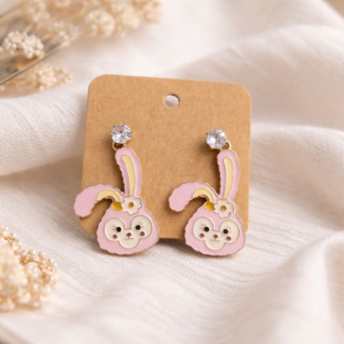 The earrings on a white cloth background 