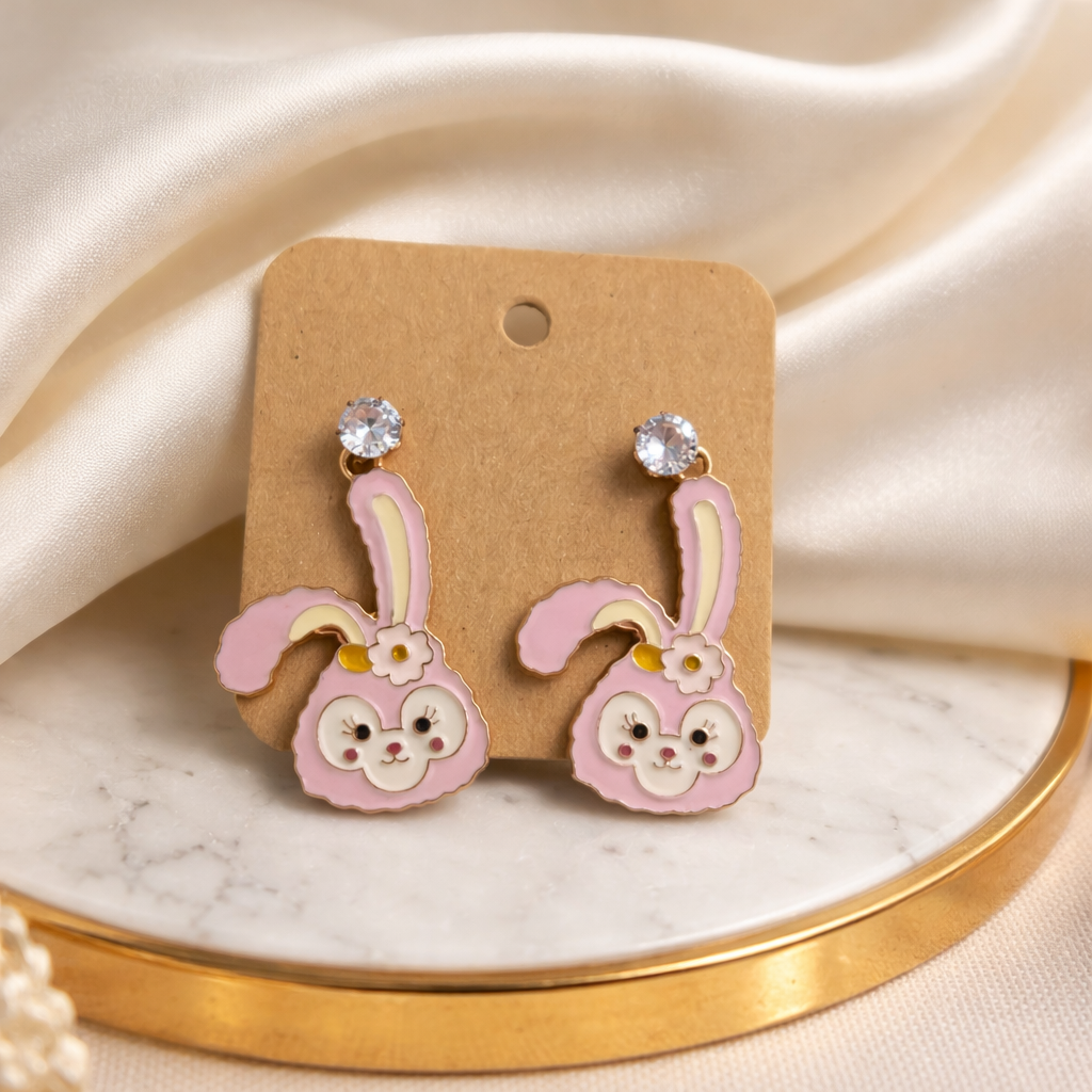 The earrings on a white marble background 