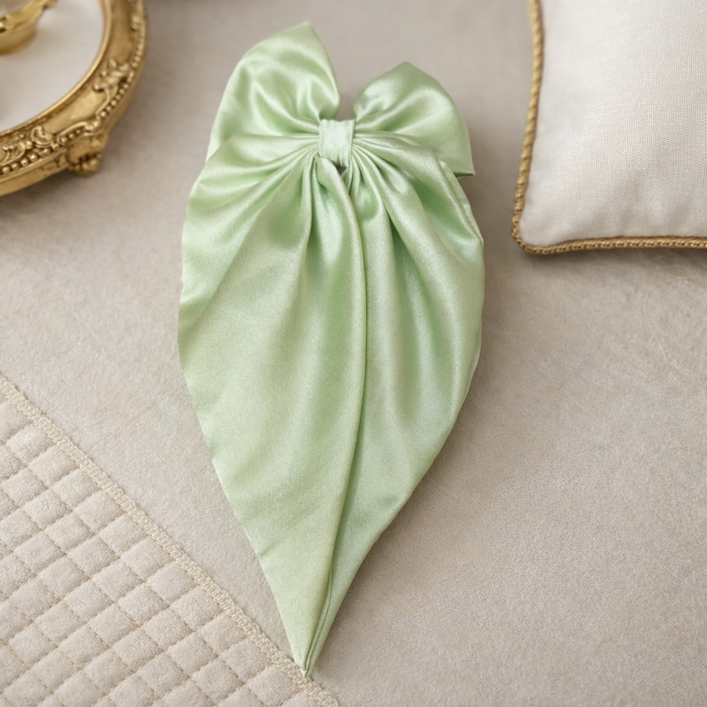 The bow on a white cloth background 