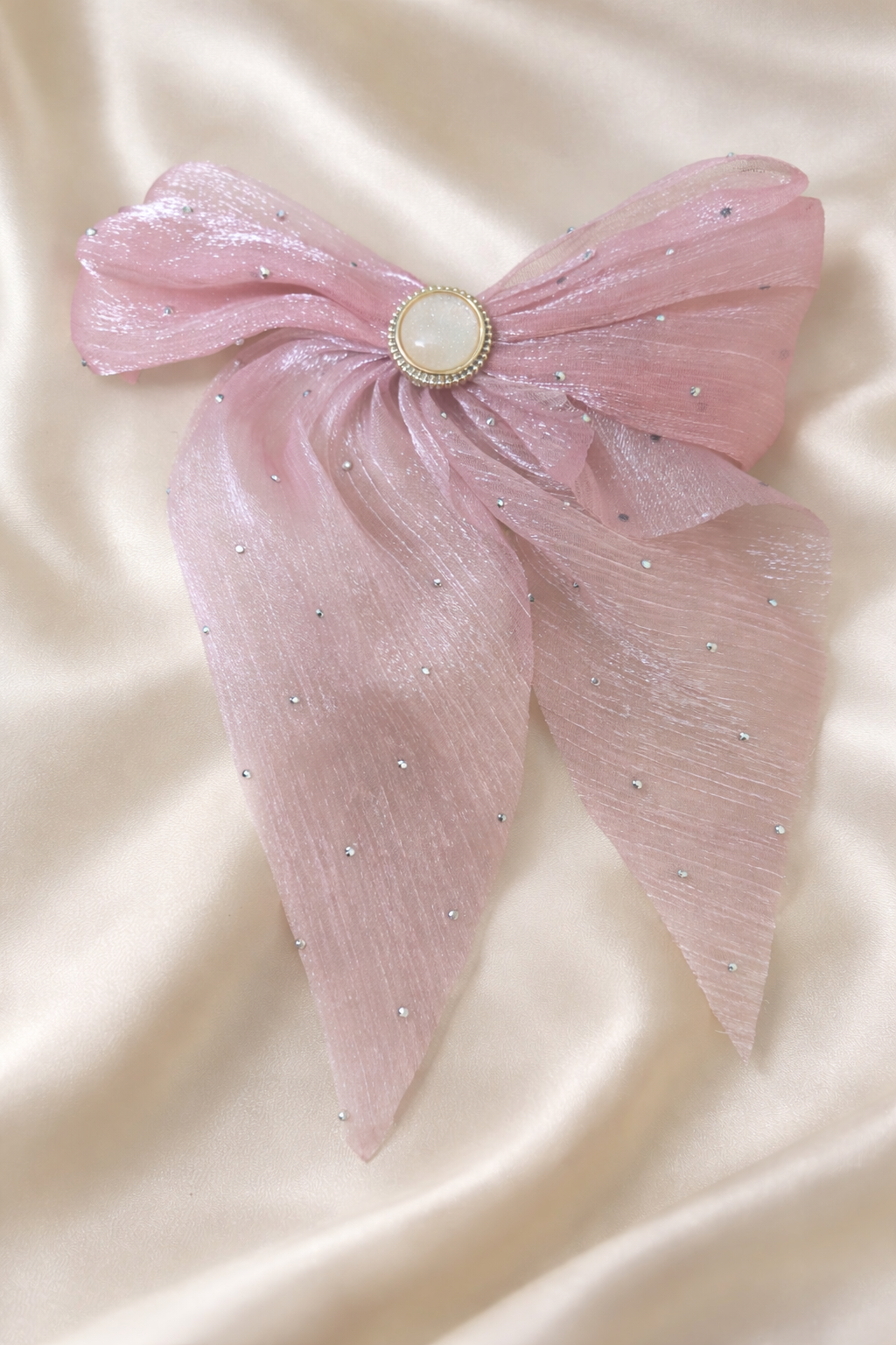 The bow on a satin cloth background 