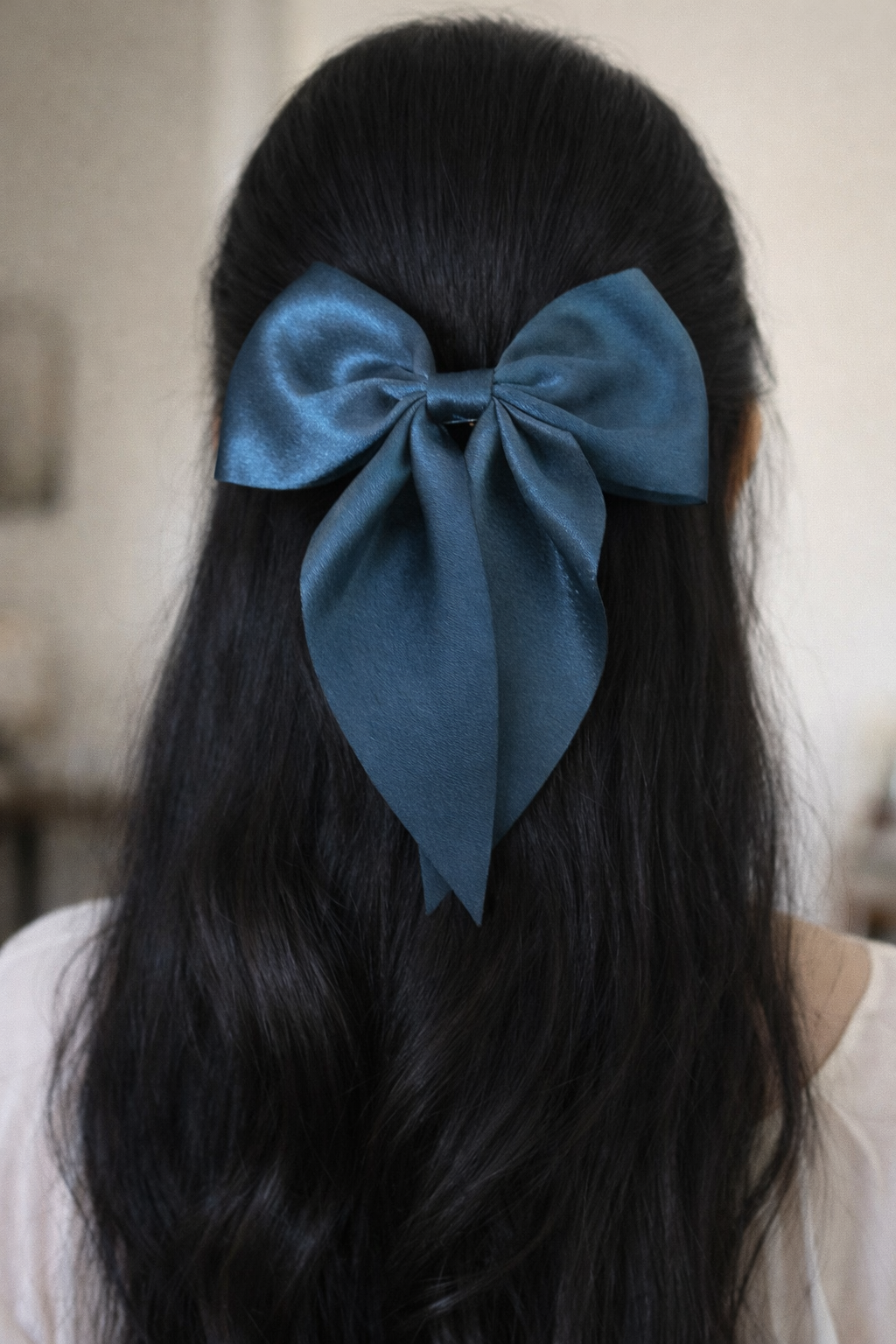 a woman wearing the teal bow 