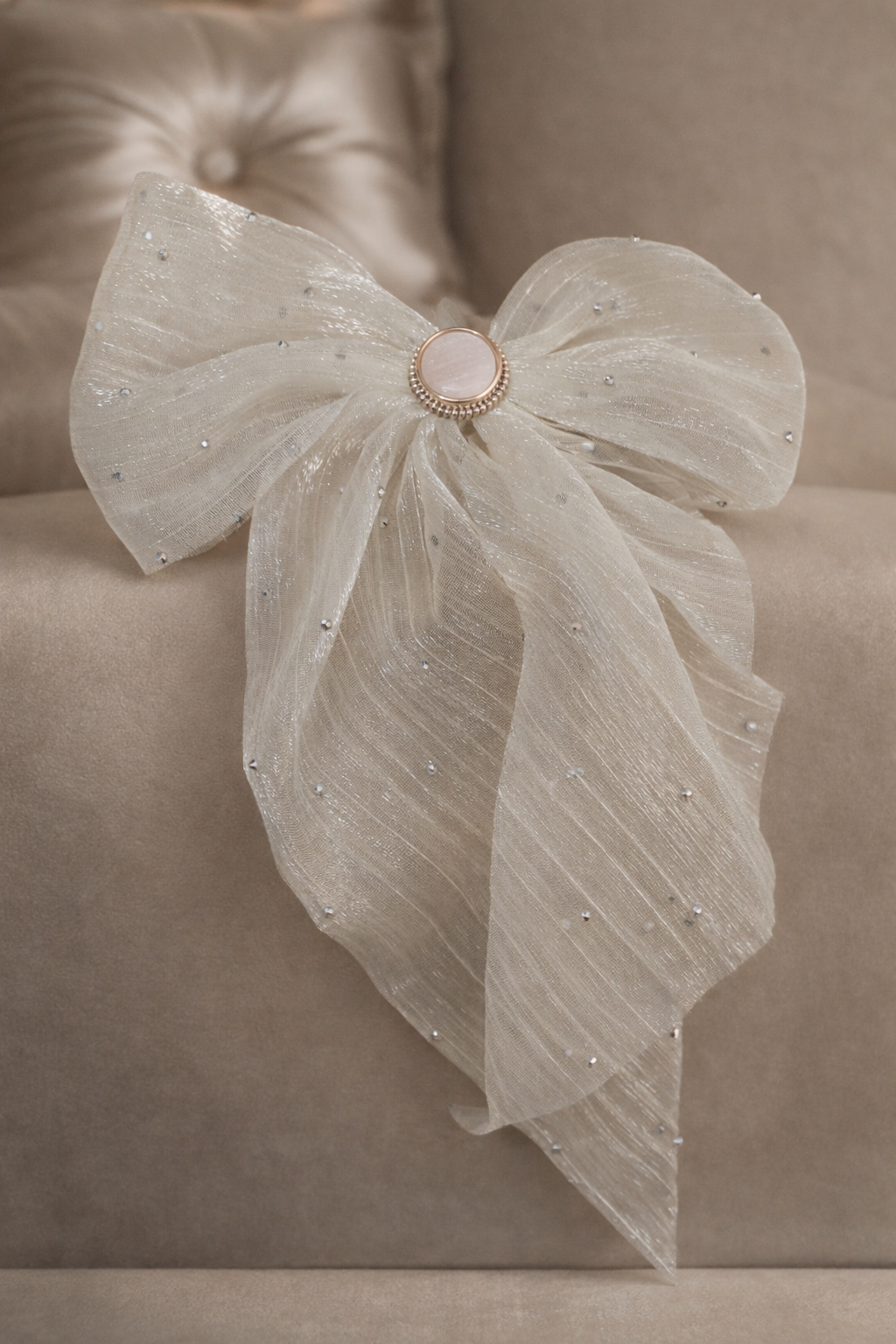 The bow sitting on a couch 