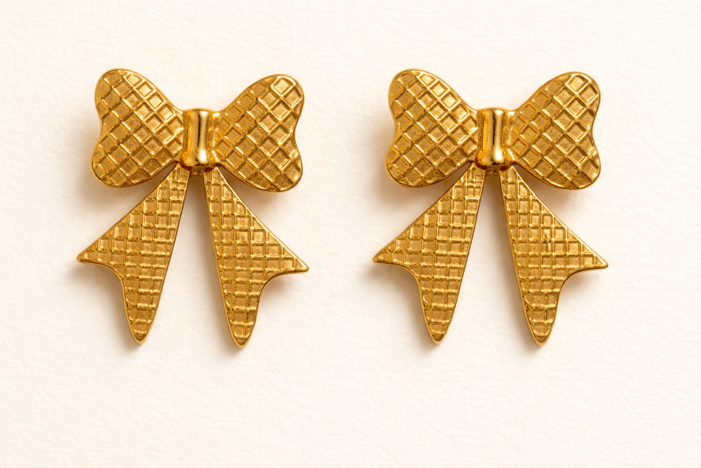 Bold gold bow-shaped statement earrings with waffle-textured finish, vintage-style geometric earrings for women