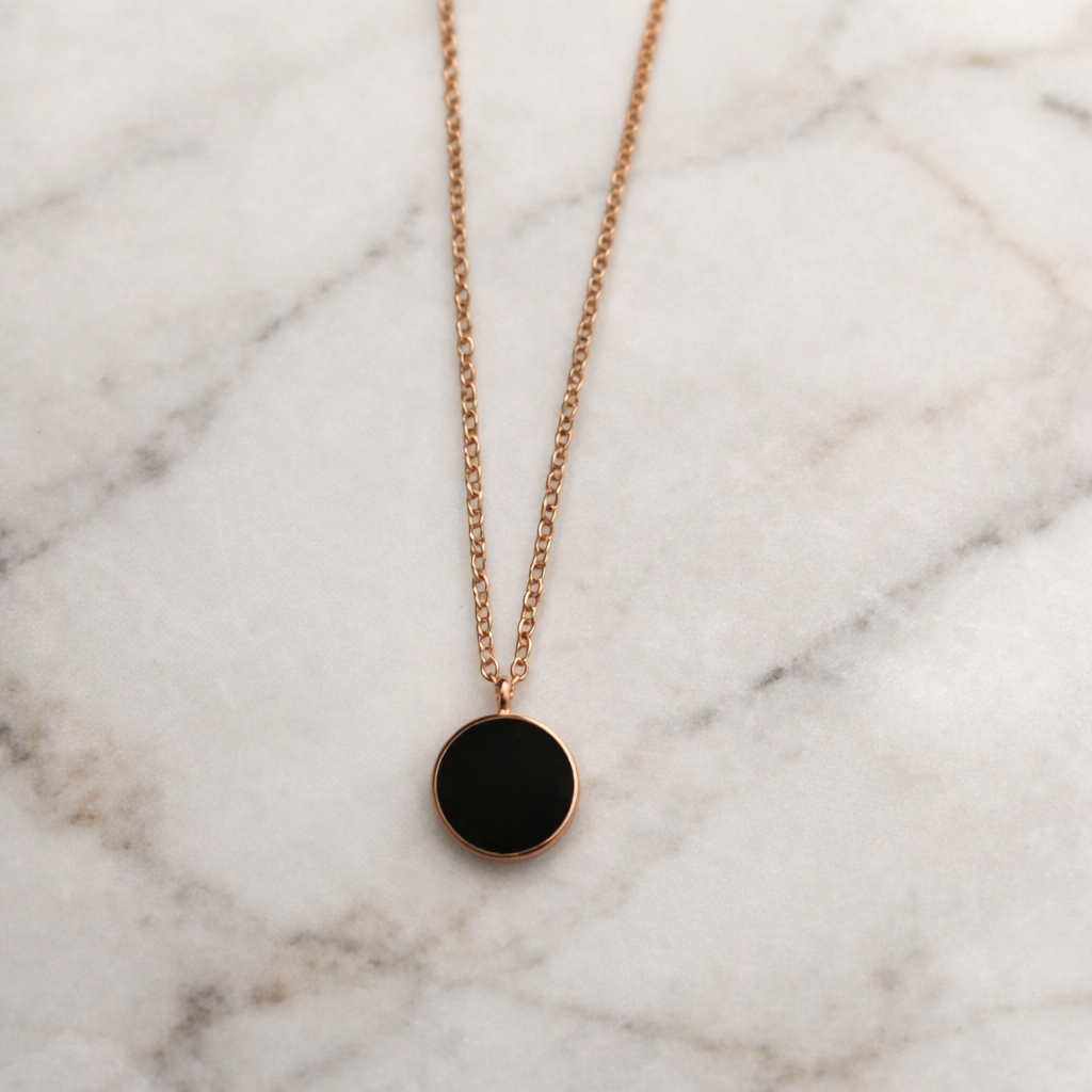 The pendant on a white marble background 