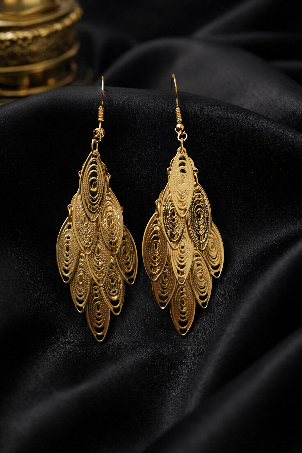 The earings on a black cloth background 