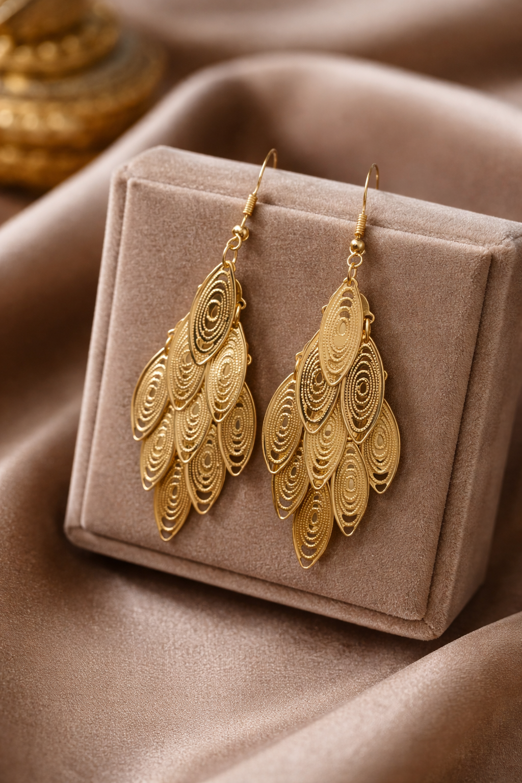 The earings on a rose colored background 