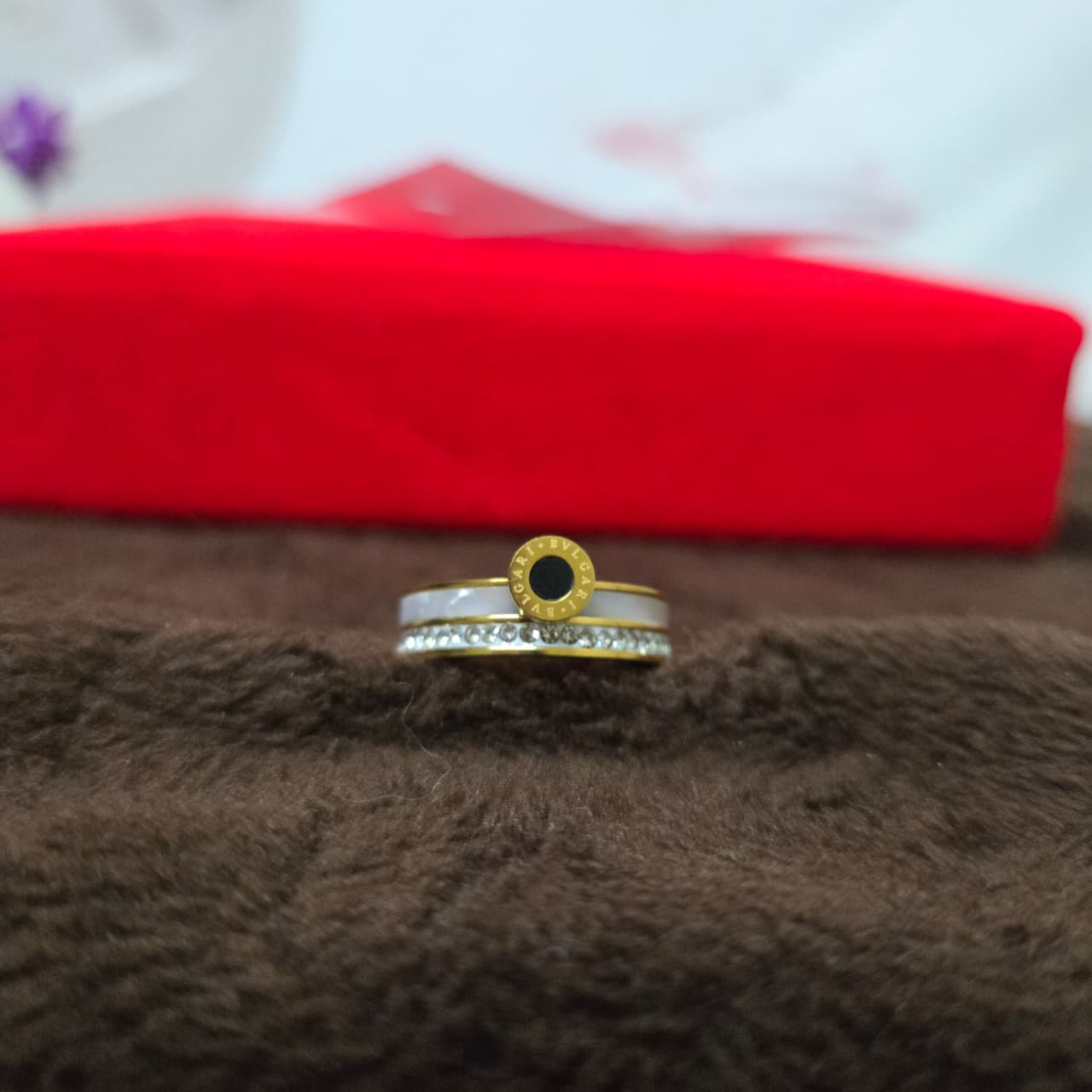 rings on a brown textured surface with a red box in the background