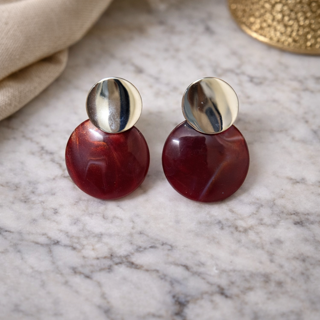 The earrings on a marble background 