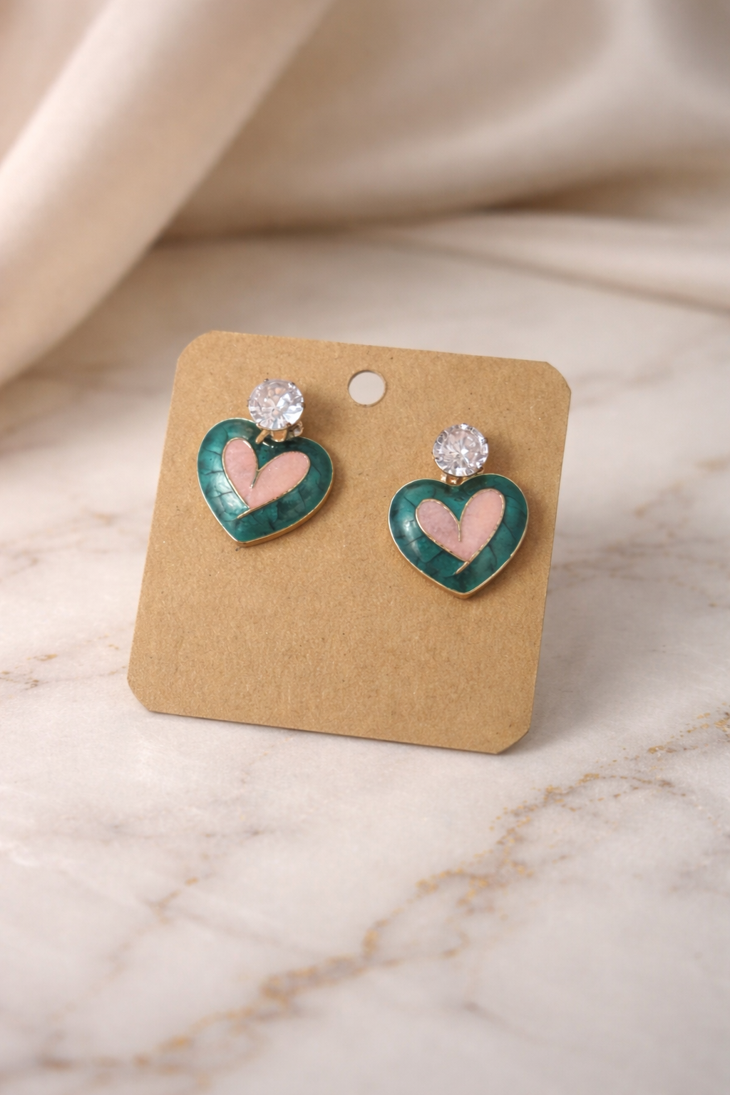 The earrings on a marble background 