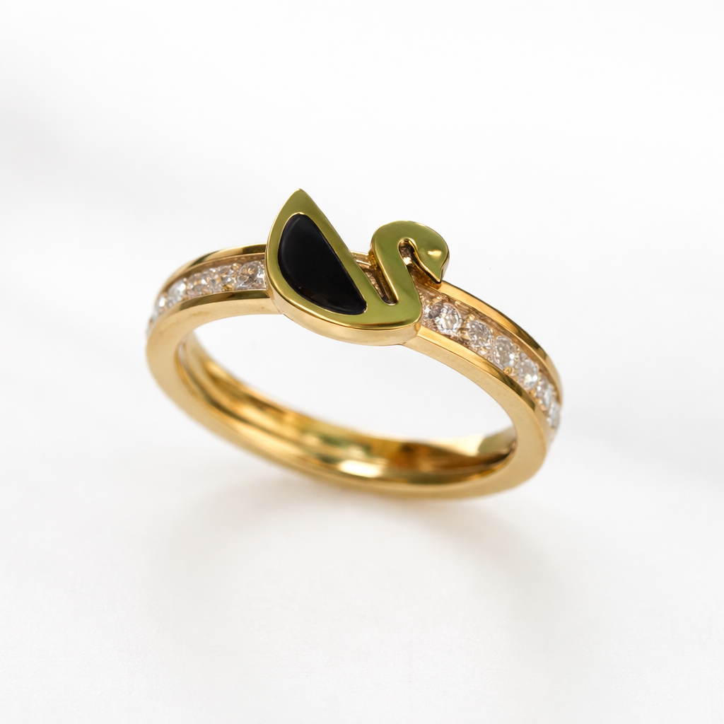 Gold ring with black stone on a white background.