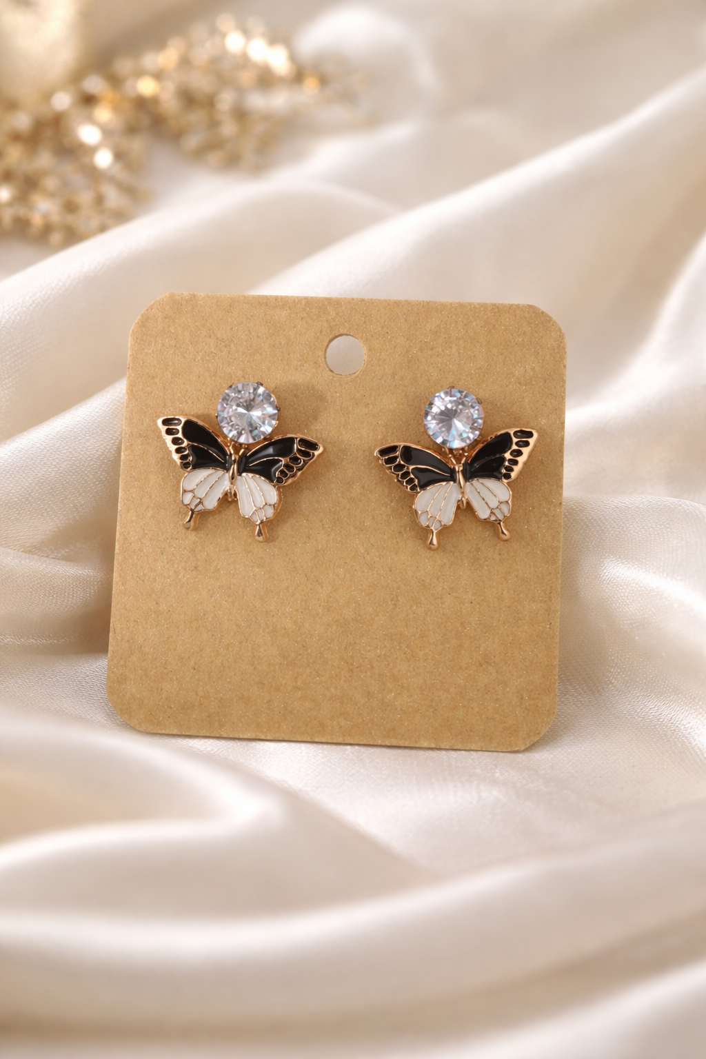The earrings on a white cloth background 