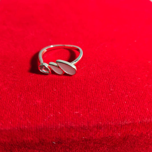 Silver ring on a red fabric background