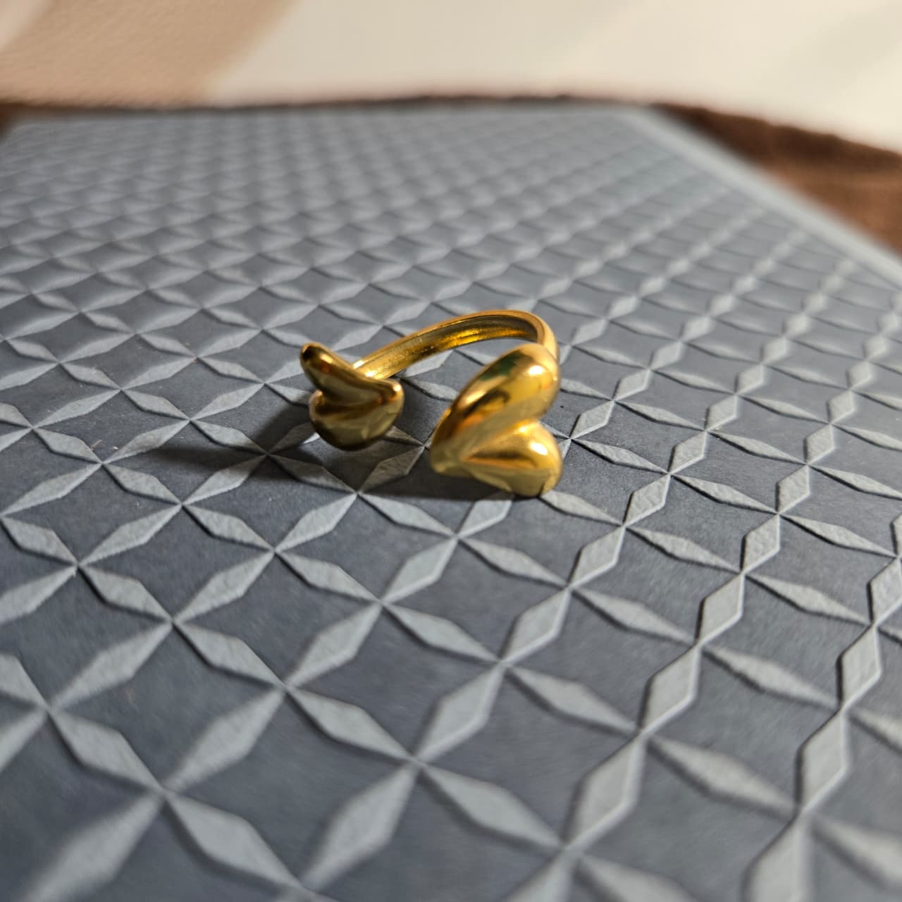 Adjustable Golden ring with the heart shape in front view