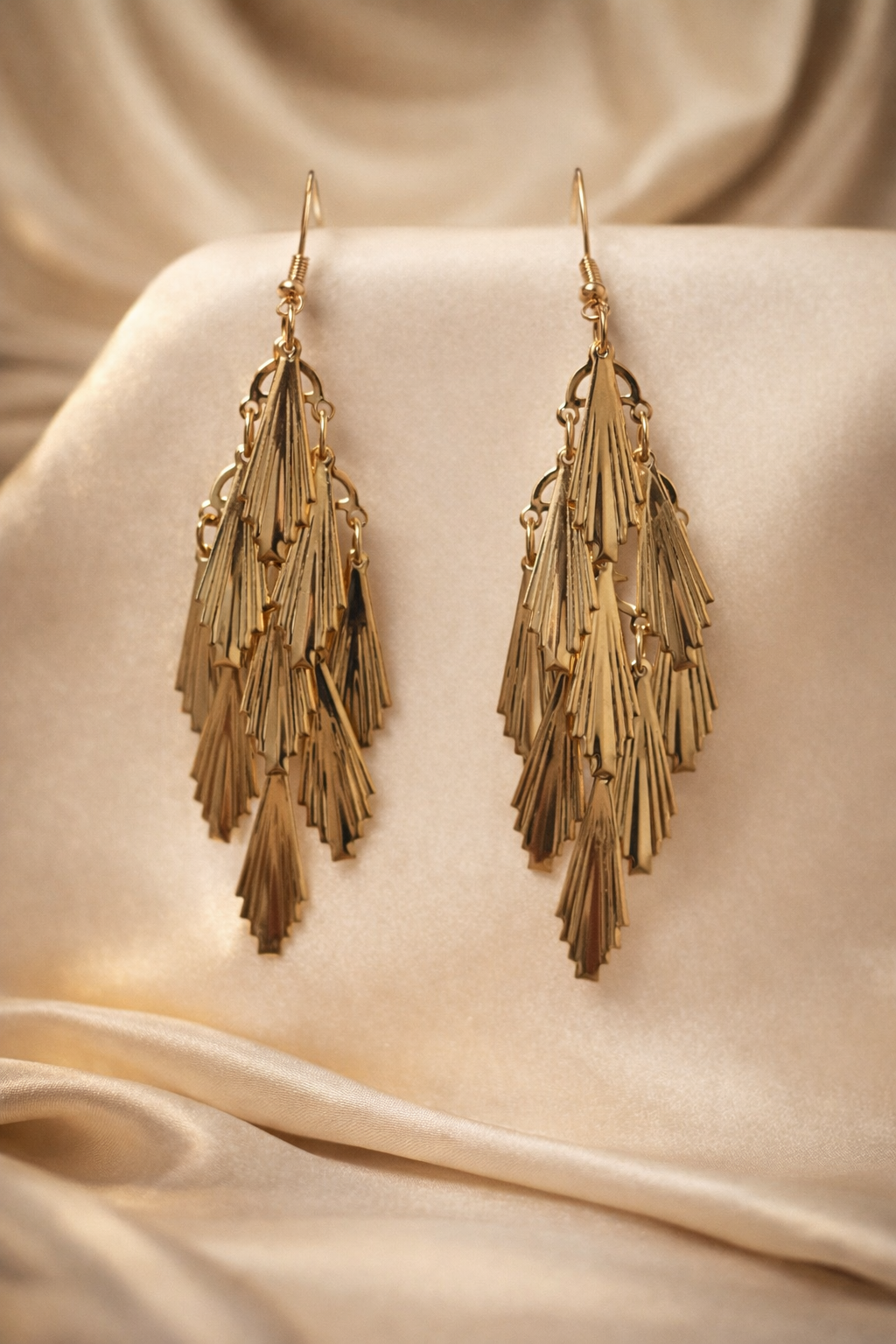 The earings on a golden cloth background 