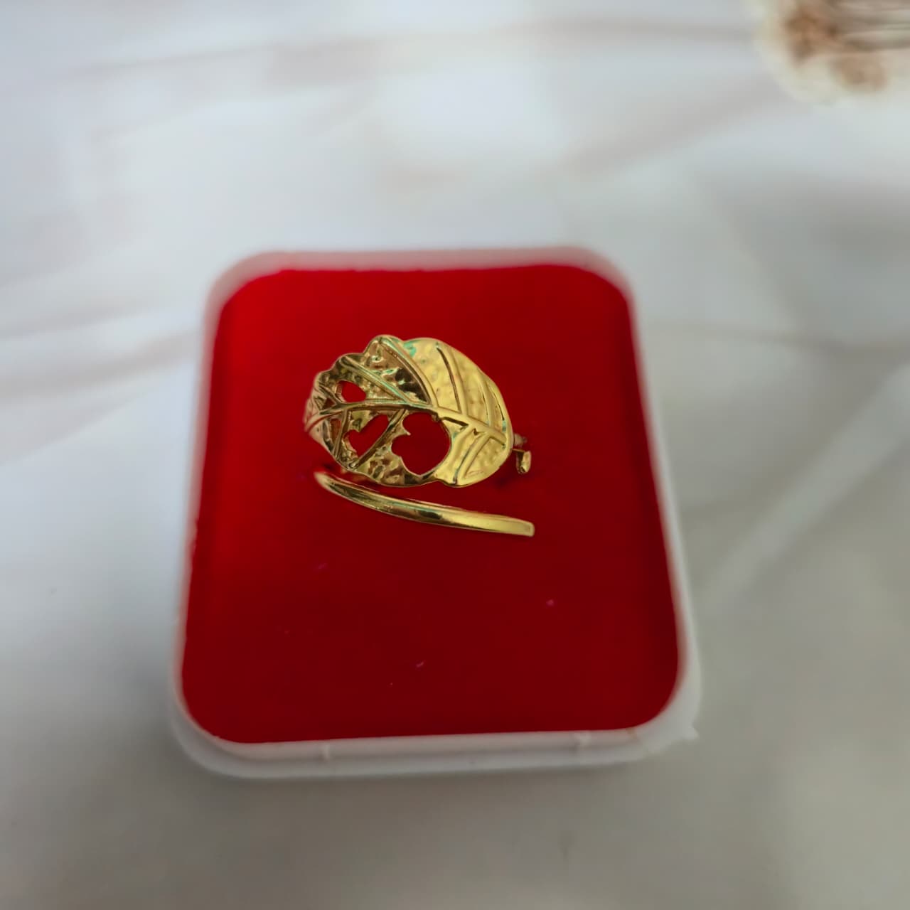Gold ring with a heart design