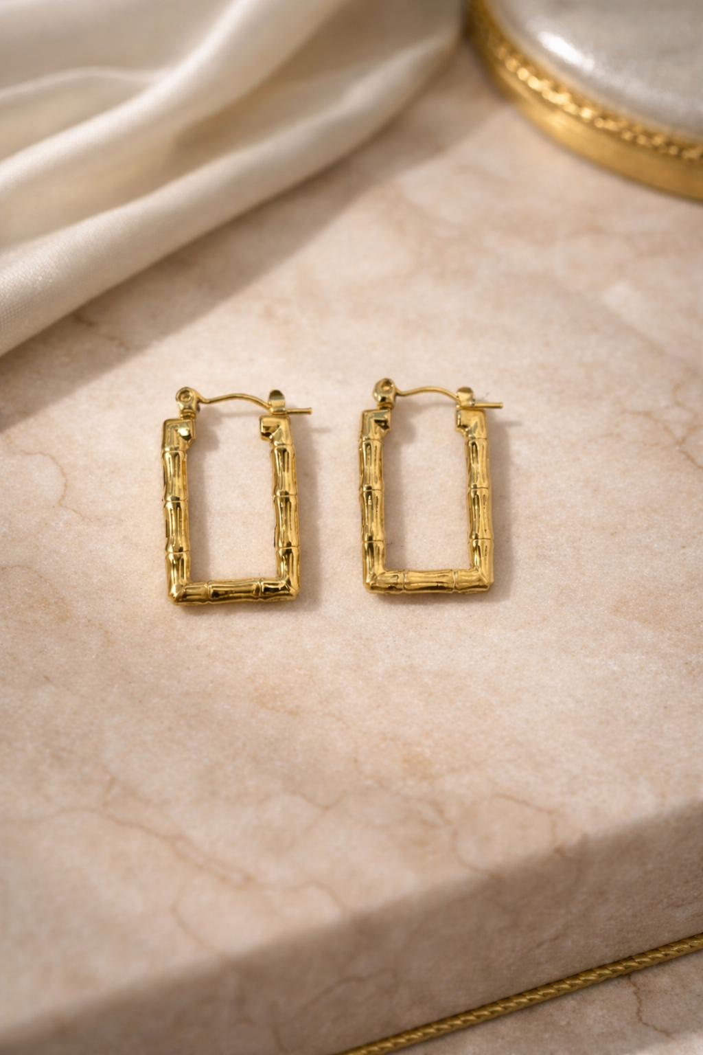 The earings on a marble background 