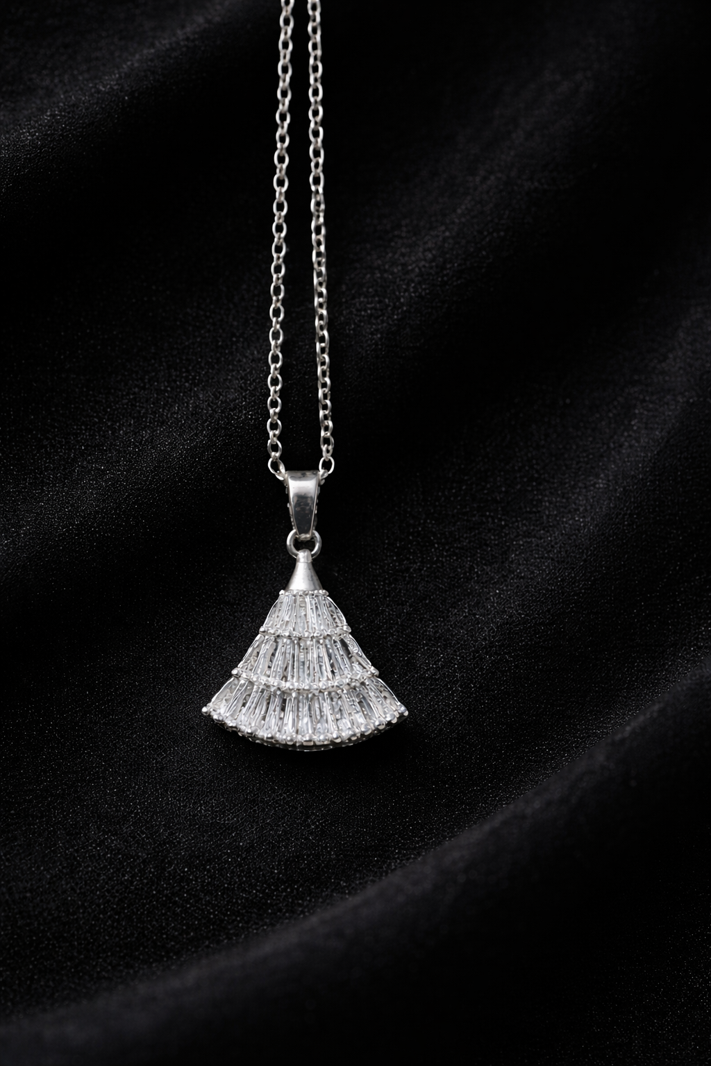 The pendant on a black cloth background 