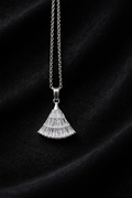 The pendant on a black cloth background 