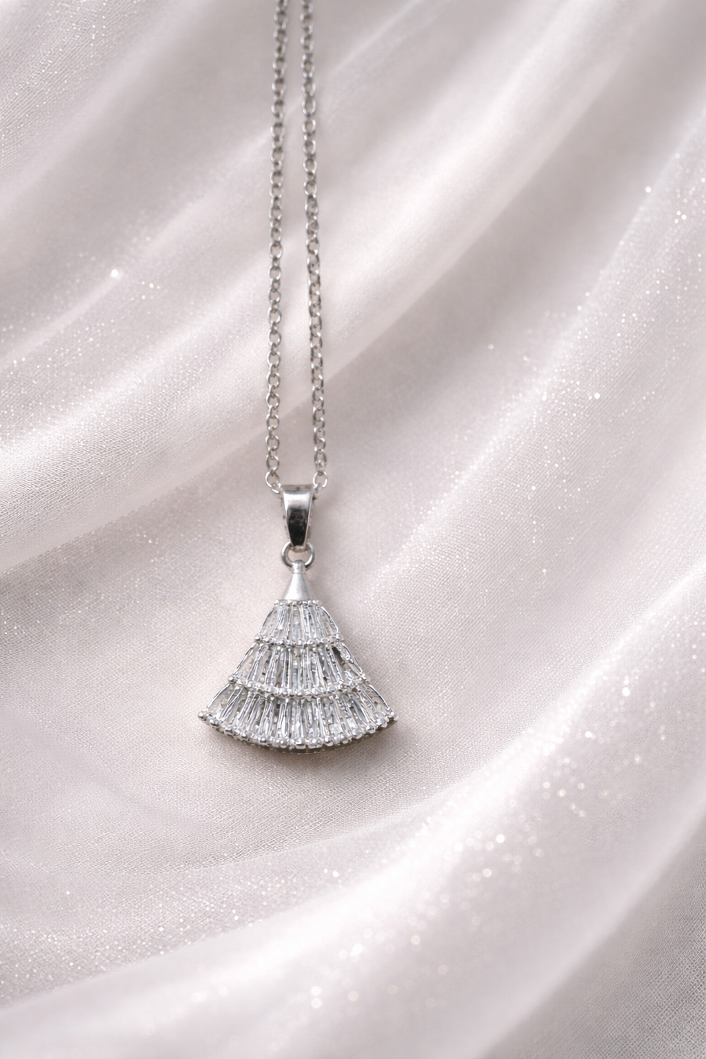 The pendant on a silver cloth background 