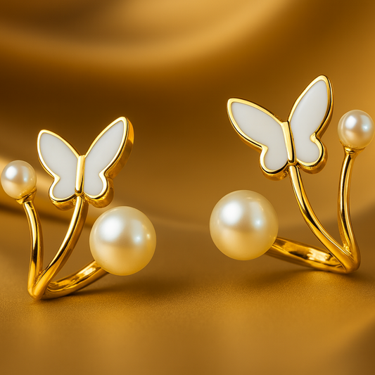 Butterfly-shaped earrings with pearls on a gold background