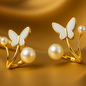 Butterfly-shaped earrings with pearls on a gold background