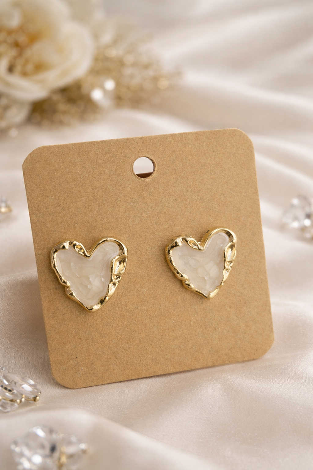 Earings on a white cloth background 