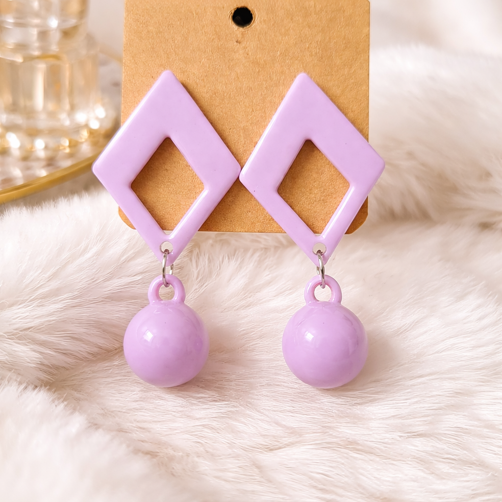 The earrings on a fur background 