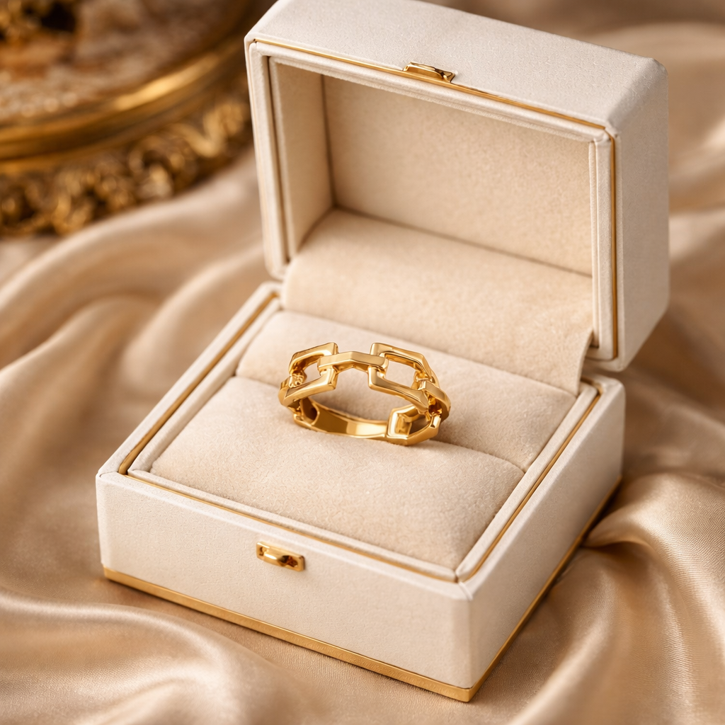 The ring in a jewelry box on a rose cloth background 