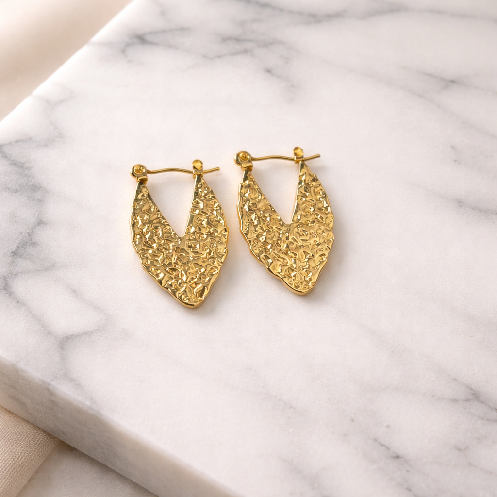 The earrings on a marble background 