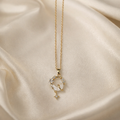 The pendant on a cream colored cloth background 