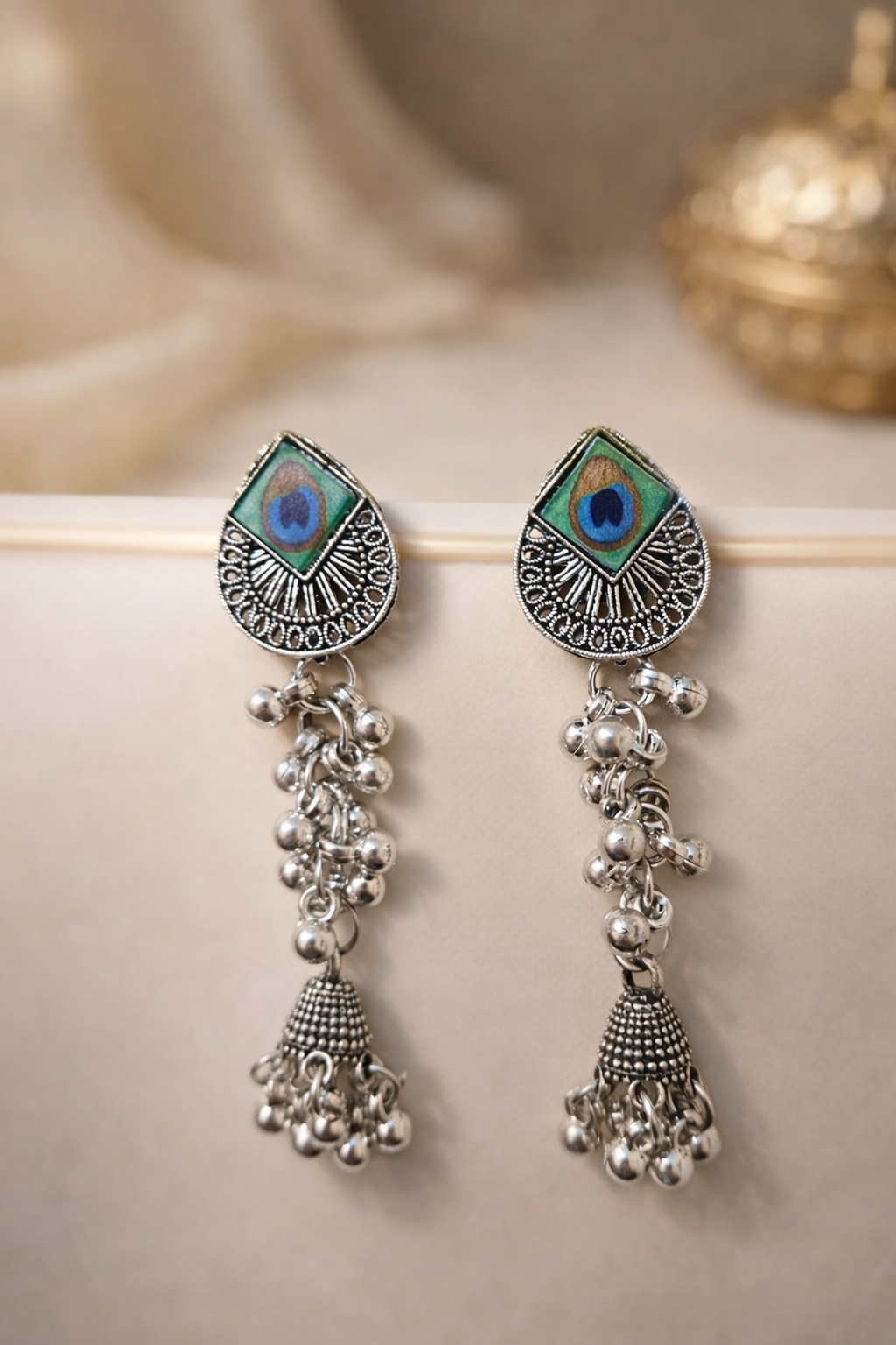 The earrings on a white cloth background 