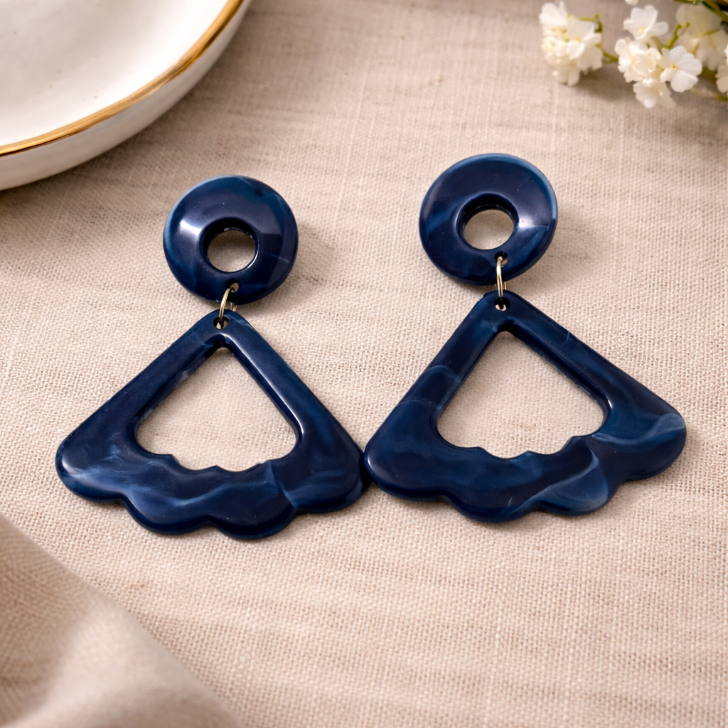 The earrings on a cloth background 