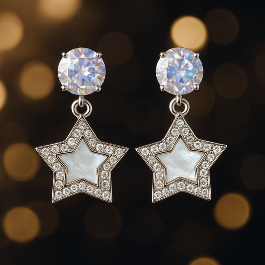 Star-shaped drop earrings with a mother-of-pearl center, surrounded by sparkling crystals, and topped with dazzling round studs for a glamorous finish