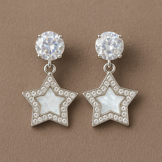 Star-shaped drop earrings with a mother-of-pearl center, surrounded by sparkling crystals, and topped with dazzling round studs for a glamorous finish