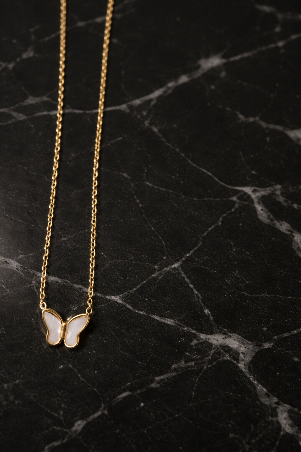 The pendant on a black marble background 