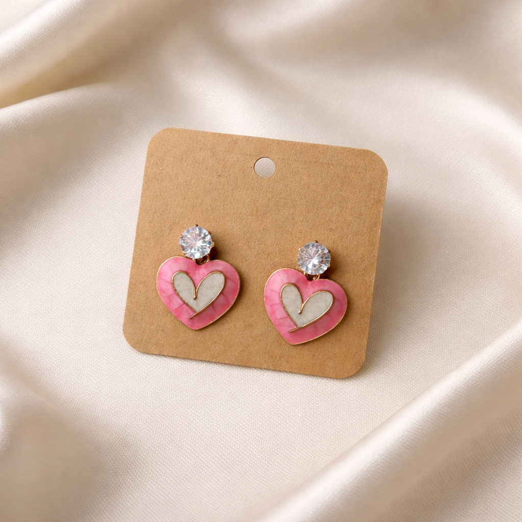 The earings on a rose cloth background