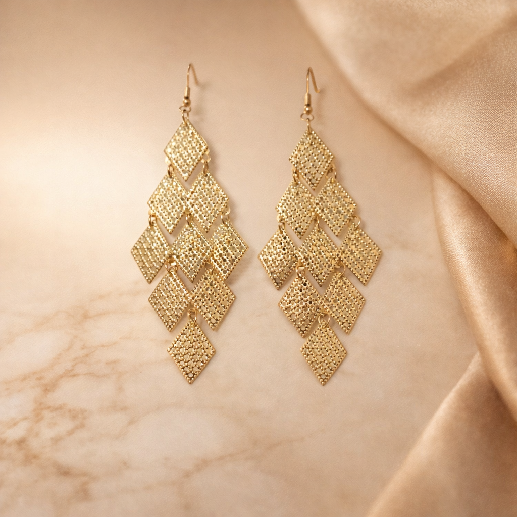 The earrings on a golden background 
