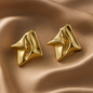 Radiant Fold Earrings – sculptural gold abstract earrings with molten fold design, luxury statement jewelry by Ora Haven.